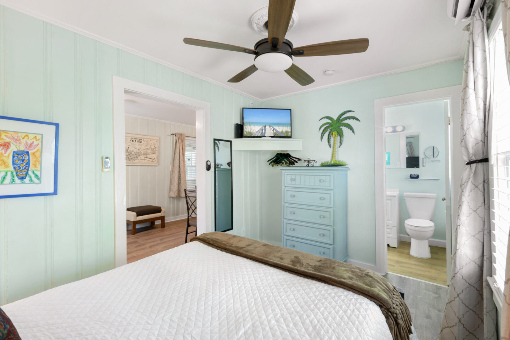 A bedroom with a tropical theme